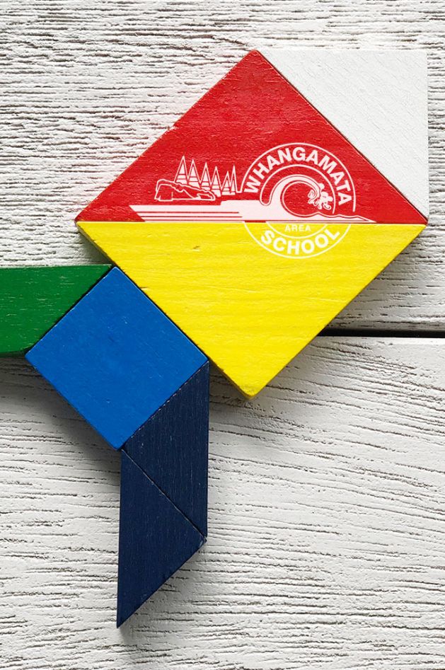 Colourful block puzzle in the shape of a rocket